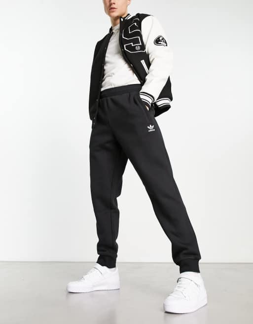 adidas Originals ESSENTIALS - Tracksuit bottoms - black 