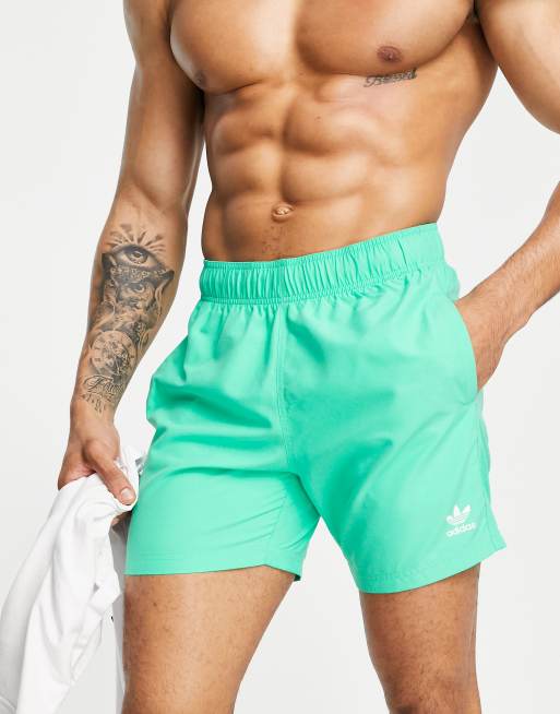 Green adidas store swim shorts