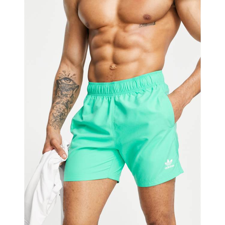 Array trimmen Susteen adidas Originals Essentials swim shorts in hi-res green | ASOS