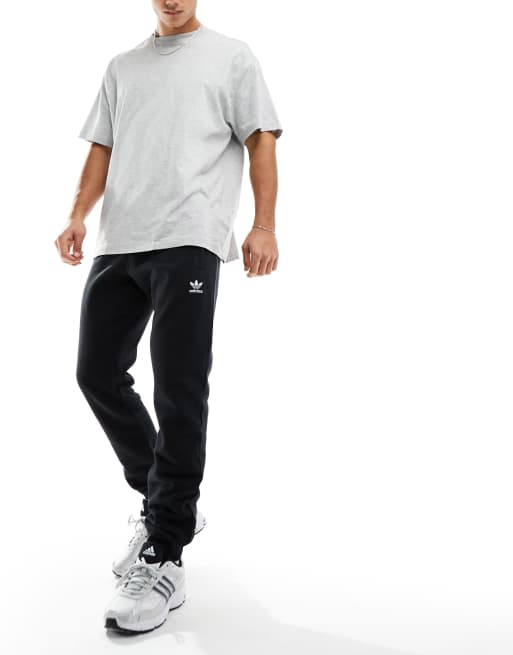 Reebok, Training Essentials Woven Mens Cuffed Pants, Performance  Tracksuit Bottoms