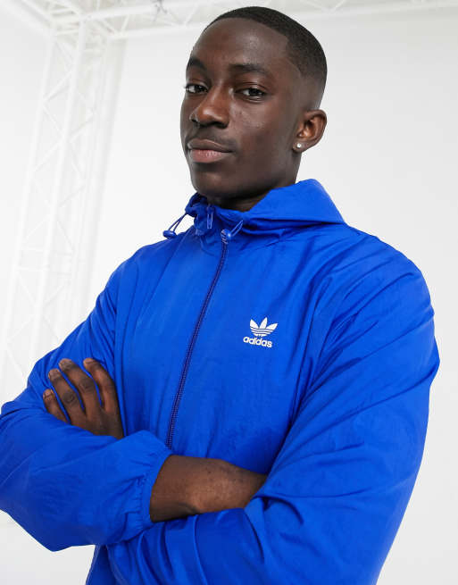 adidas Originals essentials trefoil windbreaker jacket in blue