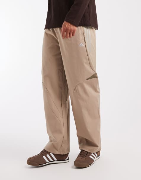 adidas Originals – F50 – Lockere, gestreifte Trainingshose in Blanch Brown - view 1