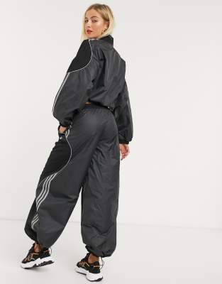 adidas originals fakten wide leg track bottoms in black