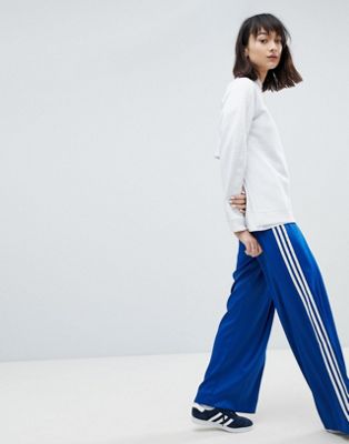 blue adidas pants outfit