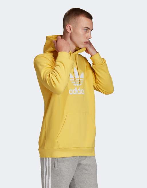 adidas - Felpa gialla cappuccio logo a trifoglio | ASOS