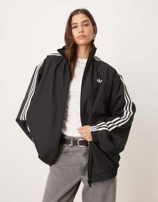 adidas Originals - Firebird Adilenium - Trainingsoberteil in Schwarz/Weiß