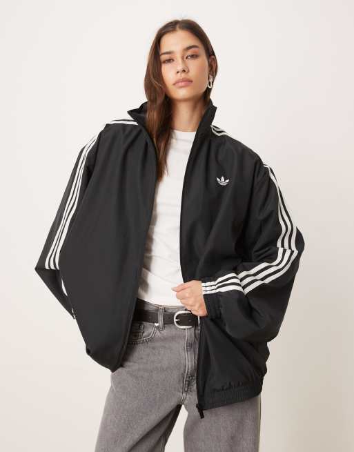 adidas Originals – Firebird Adilenium – Trainingsoberteil in Schwarz/Weiß