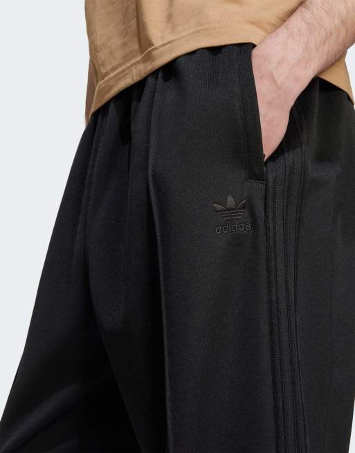adidas Originals Firebird baggy track pants in black