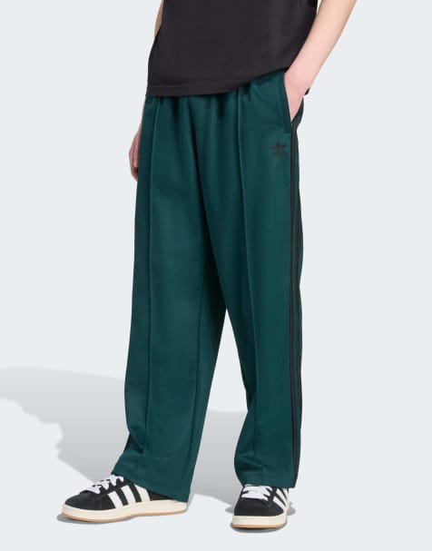 adidas Originals – Firebird – Gröna och svarta träningsbyxor i baggystil - view 1