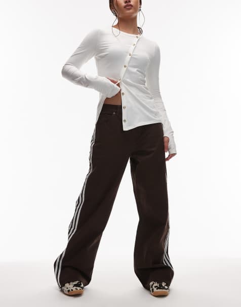 adidas Originals firebird jeans in brown - view 1