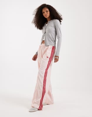 adidas Originals - Firebird - Locker geschnittene Trainingshose aus Nylon in Rosa und Rot