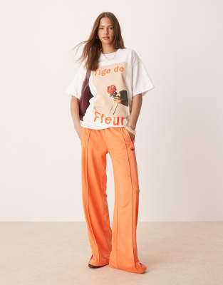 adidas Originals - Firebird - Locker geschnittene Trainingshose in Orange-Rosa