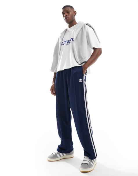 adidas Originals – Firebird – Locker sitzende Trainingshose in Marineblau - view 1