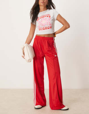 adidas Originals - Firebird - Locker sitzende Trainingshose in Rot