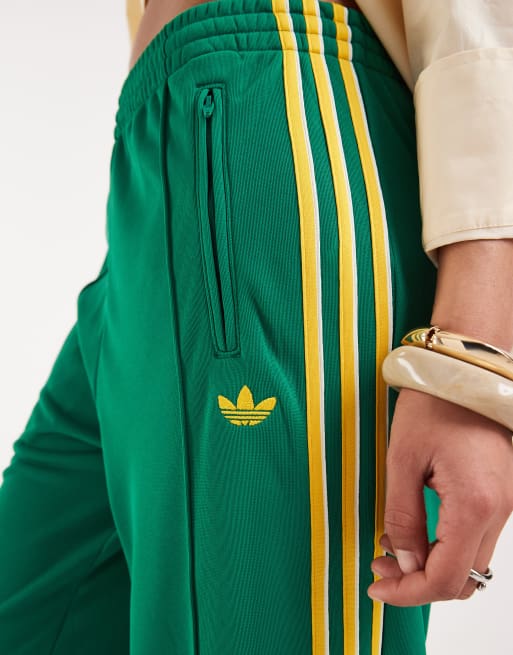 adidas Originals – Firebird – Lockere Trainingshose in Grün und Gelb, 2 von 5