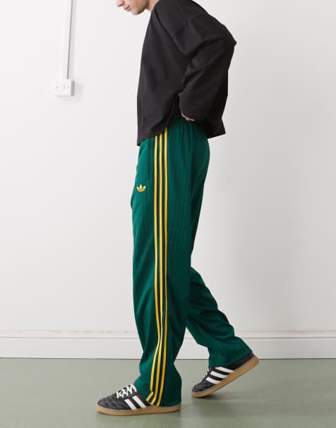adidas Originals – Firebird Loose – Locker sitzende Trainingshose in Collegiate Grün mit Nadelstreifen - view 1