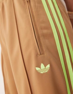 adidas Originals Firebird Loose track pants in beige and lime