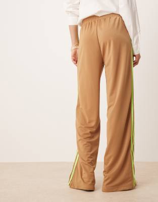 adidas Originals Firebird Loose track pants in beige and lime