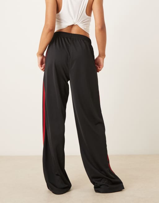 adidas Originals Firebird Loose track pants in black and red