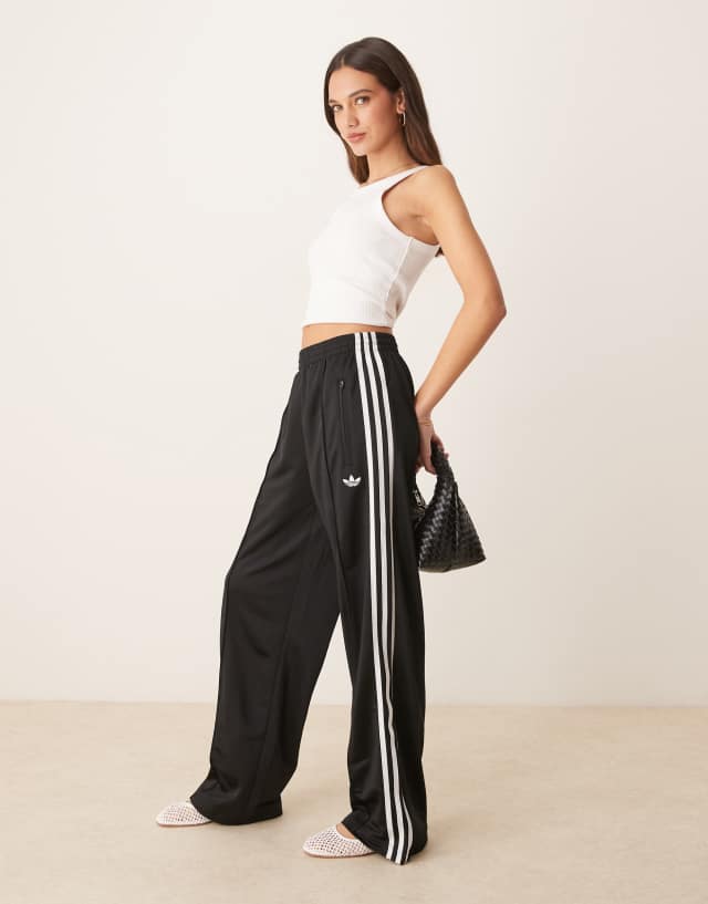 adidas Originals Firebird Loose track pants in black | ASOS