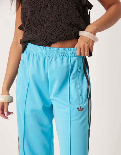 adidas Originals Firebird Loose track pants in blue and brown ASOS
