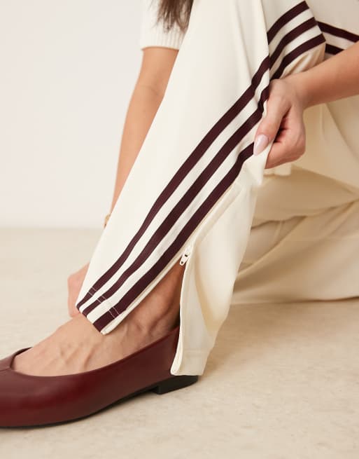 adidas Originals Firebird loose track pants in cream and burgundy