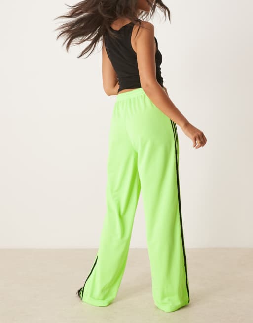 adidas Originals Firebird Loose track pants in lime | ASOS