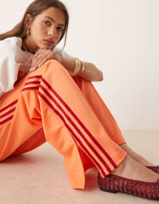 adidas Originals Firebird loose track pants in orange