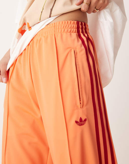 adidas Originals Firebird loose track pants in orange