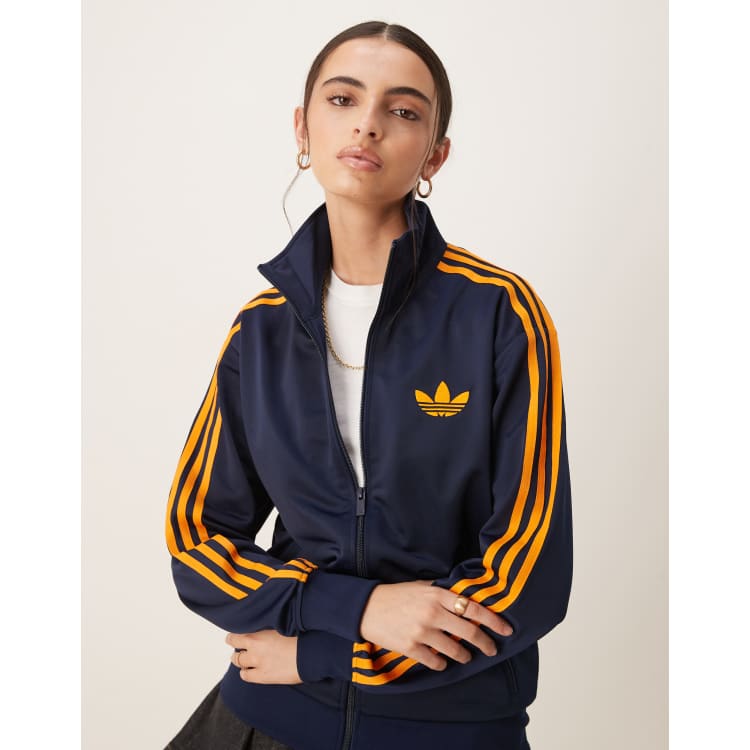 adidas Originals Firebird Loose track top in navy and orange | ASOS