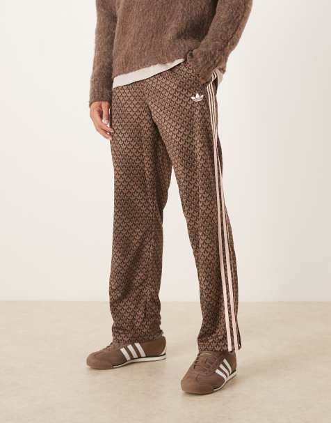 adidas Originals Firebird monogram track pants in brown - view 1