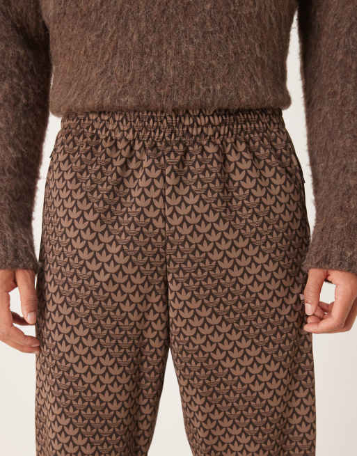 adidas Originals Firebird monogram track pants in brown | ASOS