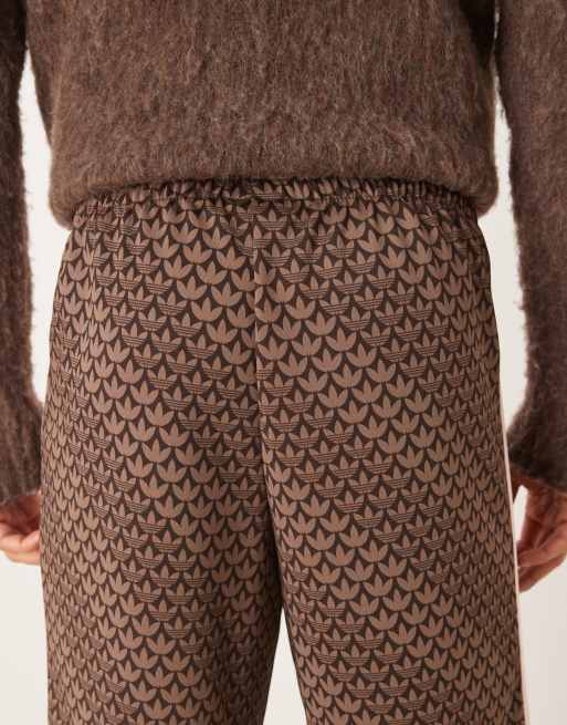 adidas Originals Firebird monogram track pants in brown | ASOS
