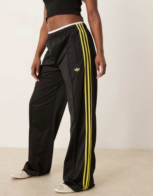 adidas Originals Firebird loose track pants in black and yellow 