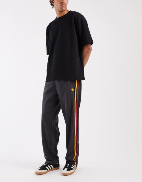 adidas Originals - Firebird - Pantalon de survêtement - Noir et doré - view 1