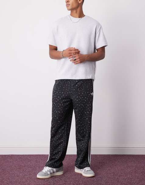 adidas Originals – Firebird – Svarta, leopardmönstrade träningsbyxor med ledig passform - view 1