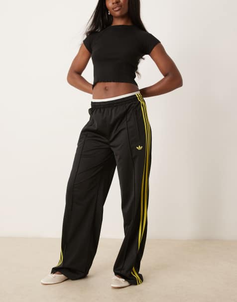 adidas Originals – Firebird – Svarta och gula träningsbyxor med ledig passform - view 1