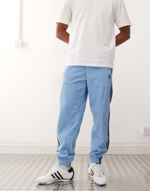 adidas Originals Firebird track pants in blue and black