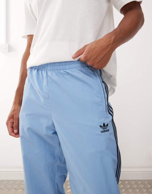 adidas Originals Firebird track pants in blue and black