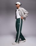 [adidas Originals] adidas Originals Firebird track pants in dark green M Mineral green