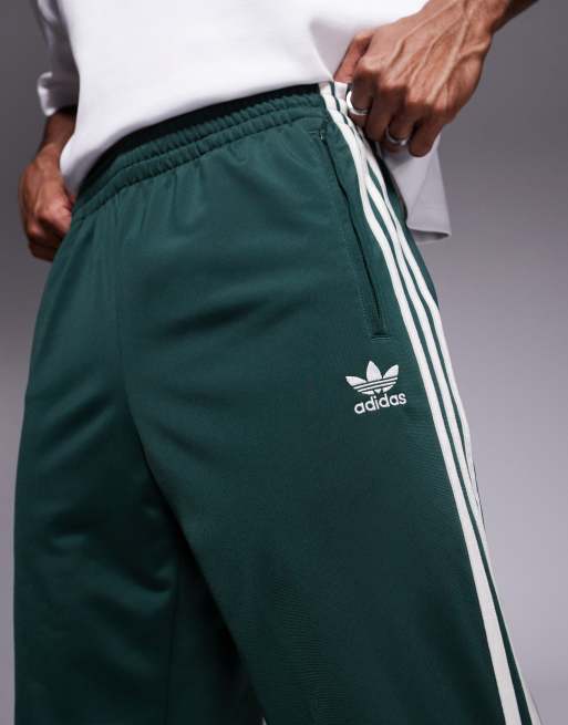 adidas Originals Firebird track pants in dark green ASOS