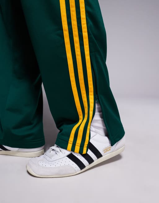 adidas Originals Firebird track pants in green and yellow ASOS