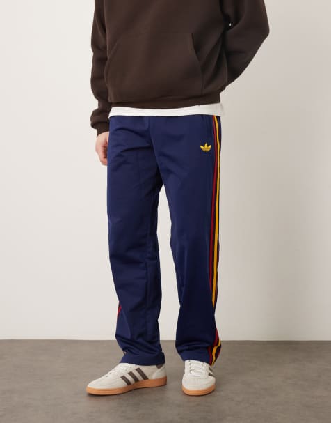 adidas Originals firebird track pants in navy and yellow - view 1
