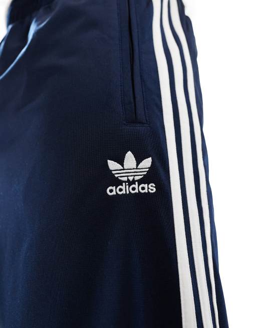 adidas Originals Firebird track pants in navy ASOS