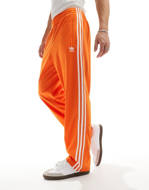 adidas Originals Firebird track pants in orange