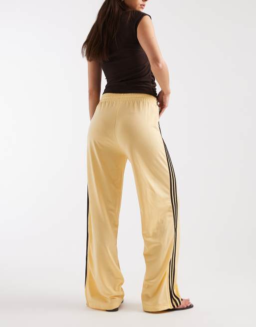 adidas Originals Firebird track pants in yellow and brown | ASOS