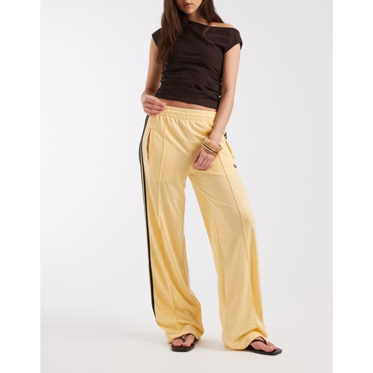 adidas Originals Firebird track set in yellow and brown | ASOS