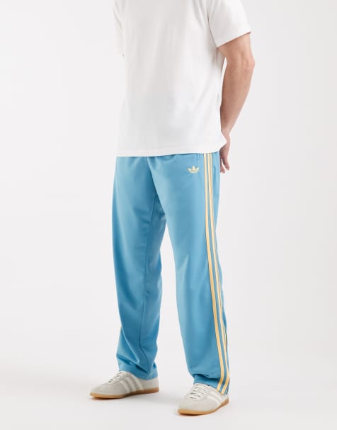 adidas Originals - Firebird - Trainingsbroek in blauw en oranje - view 1