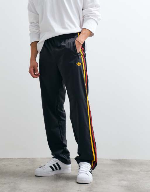 adidas Originals – Firebird – Trainingshose in Schwarz und Gold, 2 von 7