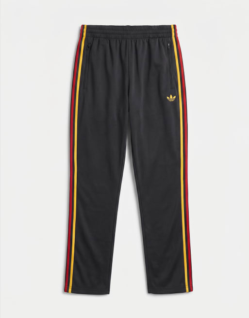 adidas Originals – Firebird – Trainingshose in Schwarz und Gold, 6 von 7